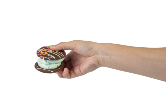 Mint filled chocolate chip cookies in hand on transparent background