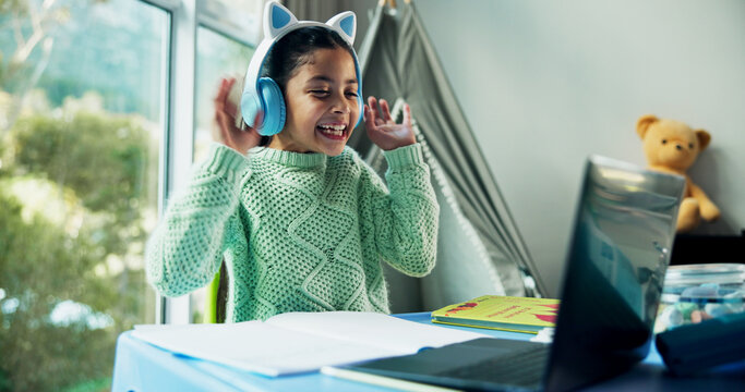 Girl, happy and headphones with laptop for homeschool, online course and e learning for development in house. Kid, education and laugh with video call, joke or virtual class with talk at apartment