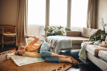 Mother taking selfie with baby at home