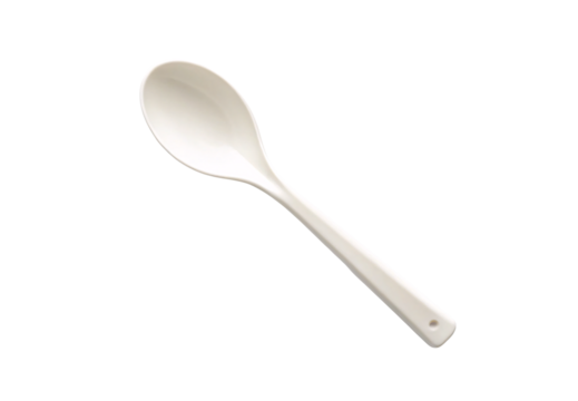 White plastic serving spoon with curved handle and small hanging loop attachment, isolated on a transparent background