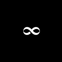 Minimalist white infinity symbol against a solid black background, representing eternity, endlessness, and limitless possibilities.