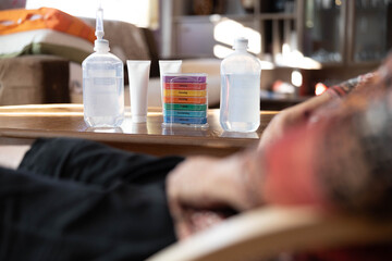 An arrangement of cosmetic products sits under warm light on a wooden table, portraying a serene atmosphere that promotes relaxation and self-care for elderly individuals.