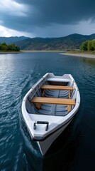 Obraz premium Serene boat floating on calm lake surrounded by scenic mountains under dramatic sky with outdoor leisure and relaxation in a peaceful outdoor environment