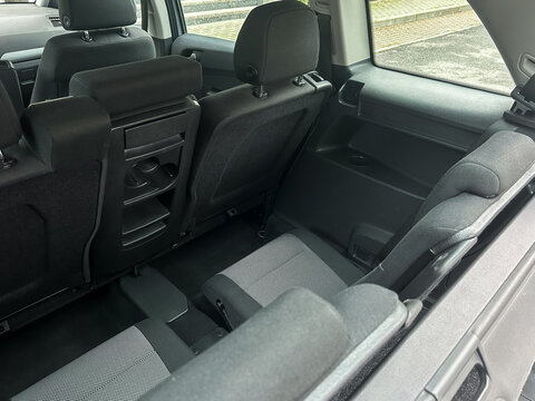 Spacious interior of a modern vehicle showcasing folded seats perfect for transporting large items or accommodating multiple passengers comfortably