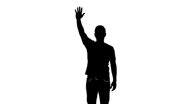 Silhouette of a man with his hand raised high in the air against a plain white background image view