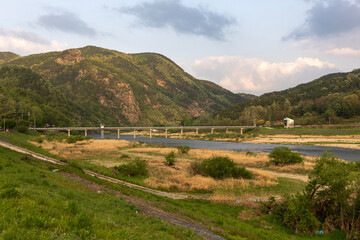 Naklejka premium landscape with river and mountains