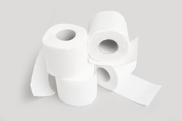Rolls of toilet paper on grey background