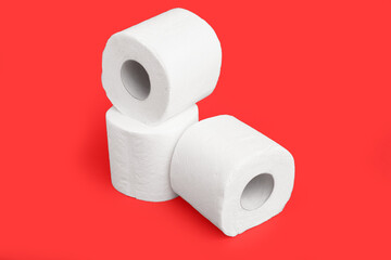 Rolls of toilet paper on red background
