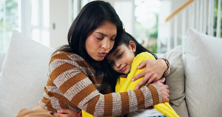 Mom, girl and sad with hug on sofa, comfort and support for mental health in lounge at apartment. People, mother and daughter in living room for embrace, console or depression on couch in family home