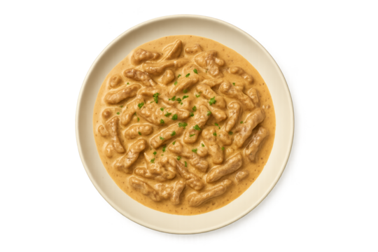 Creamy mushroom-and-chicken pieces in beige sauce, plated white dish with chive garnish