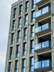 Modern apartment building with sleek balconies and large windows showcasing contemporary architecture in an urban setting