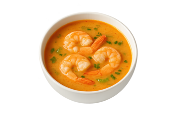 Creamy orange shrimp bisque served in white bowl, topped with fresh parsley