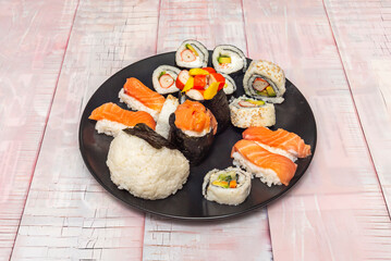  Ika squid nigiri with a thin slice of white squid on rice with a touch of wasabi between the layers.