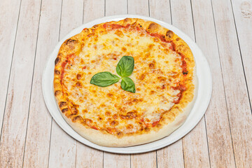 A gourmet Margherita pizza features San Marzano DOP tomatoes and Campana buffalo mozzarella on a slow-fermented dough