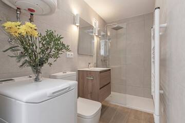 Contemporary bathroom with a circular shower, a tinted glass screen, and underfloor heating system
