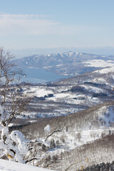 View of Lake Toya winter landscape from mountain peak, Hokkaido, Japan