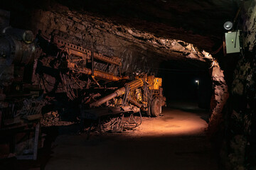 Old drilling jumbo in underground mine