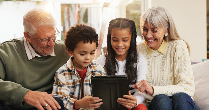 Tablet, relax and grandparents with children on sofa in home for watching movie, series or show. Happy, digital technology and senior people with kids for streaming film together in living room.