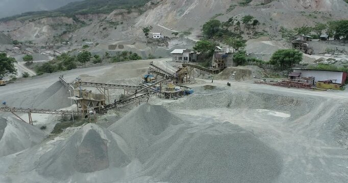 Aerial view of the landscape with mining operations showing various structures and machinery, creating a textured, industrial scene, Palu, Central Sulawesi, Indonesia.