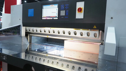 An industrial paper cutting machine equipped with a digital control panel
