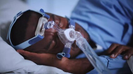 Man Wearing A Sleep Apnea CPAP Oxygen