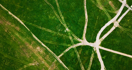 Fototapeta premium Aerial, landscape and patterns with farm in countryside for agriculture or green sustainability. Above, background and wallpaper with grass field outdoor in nature for eco friendly conservation
