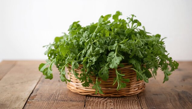 Fresh green arugula in a basket on a wooden table, a fiber-dense choice