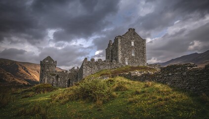 Fototapeta premium Dolbadarn Castle, an ancient fortress in ruin, showcasing erosion risk