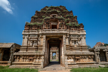 Hampi, India - 01 November 2025: View of the ornate Hazara Rama Temple's weathered stone facade under a clear sky, showcasing intricate carvings and ancient beauty.