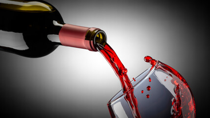 A dramatic product photography shot of red wine being poured from a dark glass wine bottle against a black and white gradient background