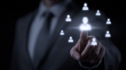 Naklejka premium Businessman Touching Virtual Screen Displaying Network of People, Demonstrating Human Resources or Social Media Management