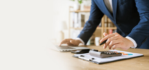 Businessman hands working on laptop at modern office, planning, investment concept, internet search, people connection concept.