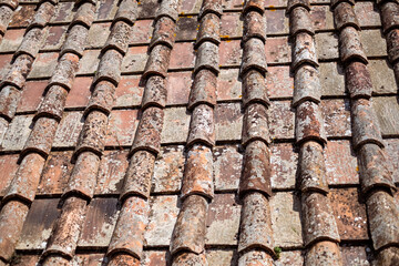 Roof tile arrangement showcasing a blend of clay and slate materials, emphasizing durability and innovative architecture with a long-lasting solution for modern buildings