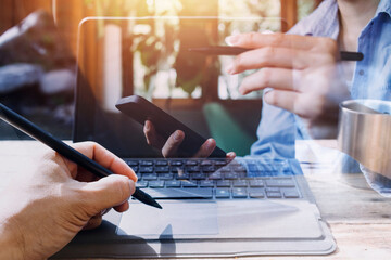 Business team present. professional investor working new start up project. Finance managers meeting.Digital tablet docking screen computer design smart phone using, in morning light