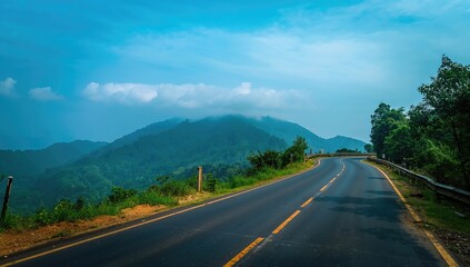 Naklejka premium The winding roads of a hill area with the Western Ghats in the backdrop, scenic travel route, landscape preservation