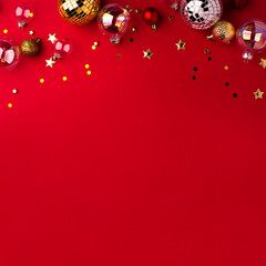 Festive Christmas ornaments on a red background.