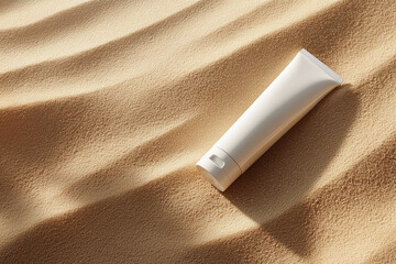 overhead shot of an unbranded white tube lying on the sand, bathed in warm sunlight. the sand has subtle shadows from the sun. this scene creates a tranquil and serene atmosphere, perfect for showcasi