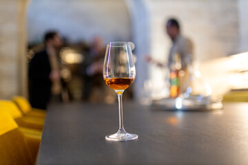 Amontillado sherry glass on refined counter in bar