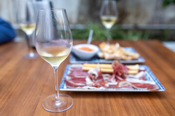 Enjoying manzanilla sherry with iberian ham tapas