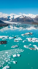 Stunning Aerial View of a Turquoise Glacier Lake with Floating Icebergs and Snow-Capped Mountains.