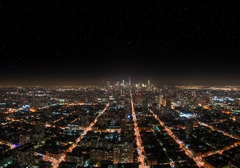 Stunning Night View of a Sprawling Cityscape with Illuminated Streets and Distant Skyscrapers.