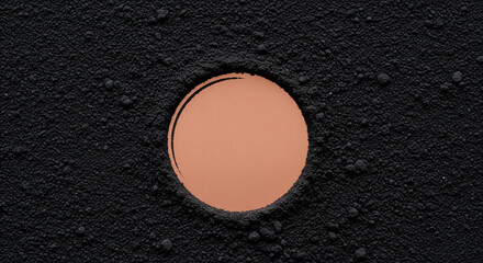 Copper Circle Embedded in Textured Black Surface