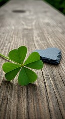 Lucky Clover on a Wooden Surface with a Small Stone.