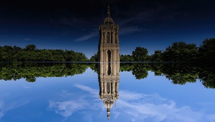 Reflection of a cathedral tower in water, preservation
