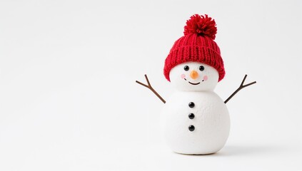 Fototapeta premium A snowman wearing a red knit cap stands isolated on a white backdrop, seasonal decoration