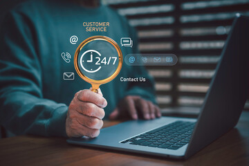 24/7 customer service concept with magnifying glass and laptop, representing online communication, call center, email, and support contact. Ideal for business technology and digital marketing themes.