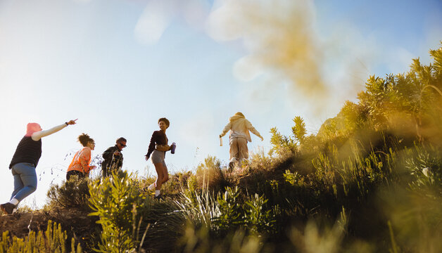 Group hiking on a sunny hillside