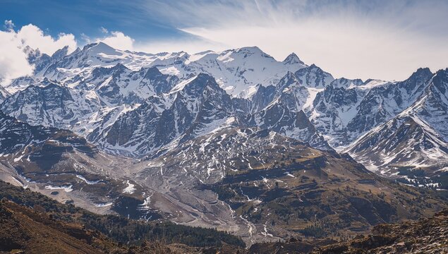 Melting snow on mountain peaks in March, seasonal change