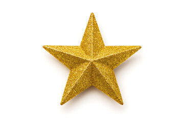 Obraz premium A single golden star ornament with glitter on a white background