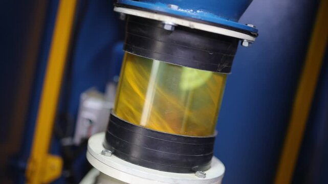 Turmeric powder grinding in a machine, slow motion scene for a corporate film in a factory, haldi powder 